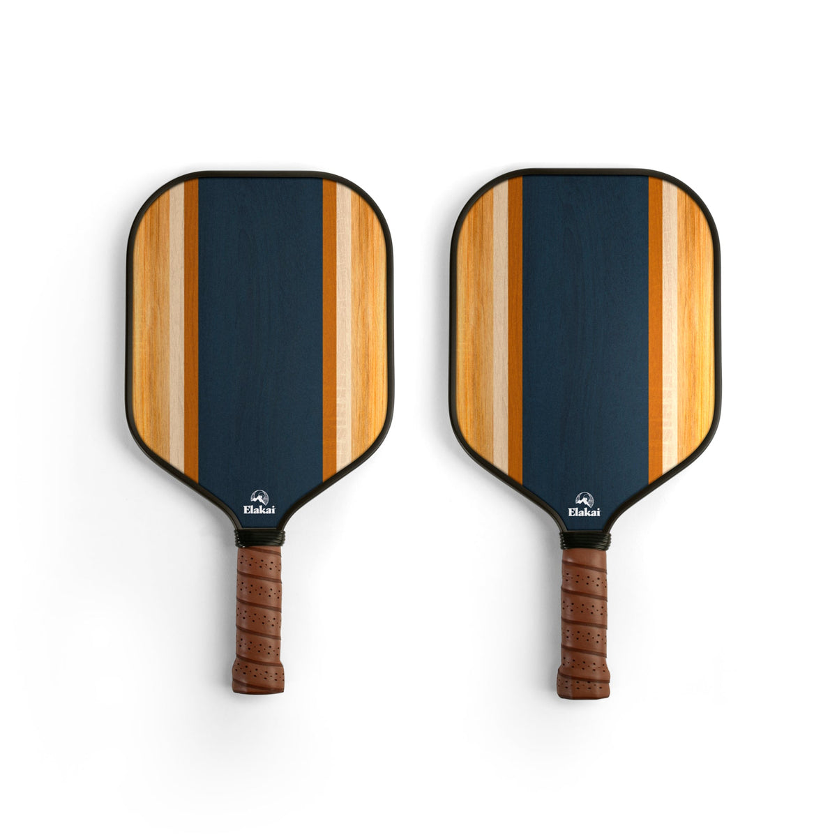 Two 16MM Woody Surf Pickleball Paddles, featuring dark blue centers, light brown stripes, and brown textured grips, crafted from high-performance materials by Elakai, are placed side by side on a white background.