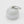 A small round white plastic container with a metal carabiner attached at the top, photographed on a clean white background.