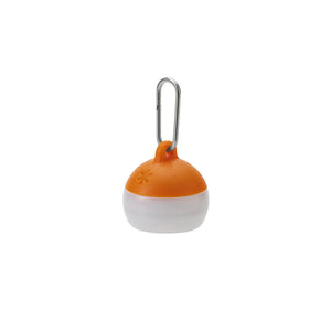 Orange and white ball with a metal clip on a white background