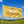 Yellow flag with 'Airstream Live Riveted' text against a blue sky and green landscape