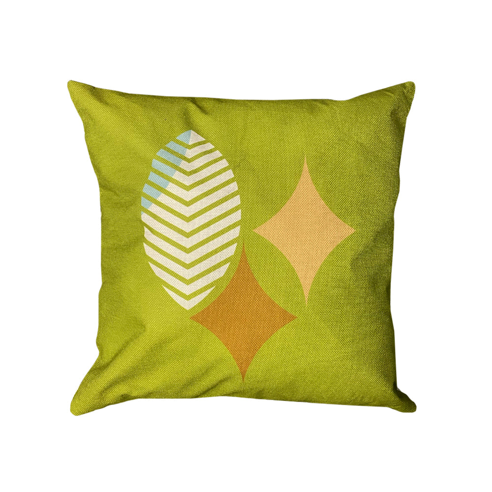 Frank Lloyd Wright x Airstream Pillow: Modern decorative pillow with a solid green background, featuring a chevron-patterned leaf and two diamond shapes in beige and orange, inspired by Frank Lloyd Wright’s design.