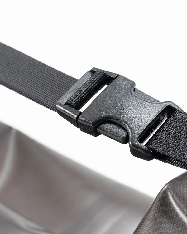 Close-up of a black belt with a plastic buckle on a white background