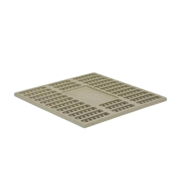 A tan, square plastic grid panel with a raised rectangular pattern and small ventilation holes, similar to the design of the Snow Peak Fireplace Coal Bed, lying flat on a white background.
