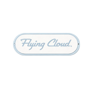 Decorative sign with 'Flying Cloud' text on a light gray background