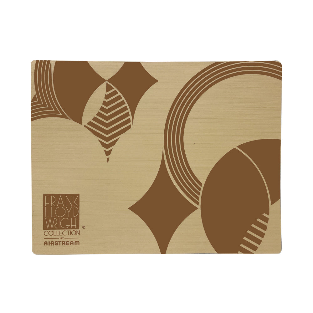 Introducing the Frank Lloyd Wright x Airstream Entry Mat: a tan rectangular doormat featuring geometric brown patterns inspired by Frank Lloyd Wright. Showcasing both the Frank Lloyd Wright Collection and Airstream logos in the lower left corner, this durable outdoor mat adds stylish flair to any Airstream entryway.