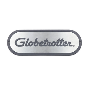 Metallic oval sign with 'Globetrotter' branding on a white background