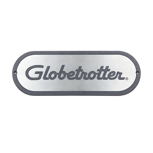 Metallic oval sign with 'Globetrotter' branding on a white background