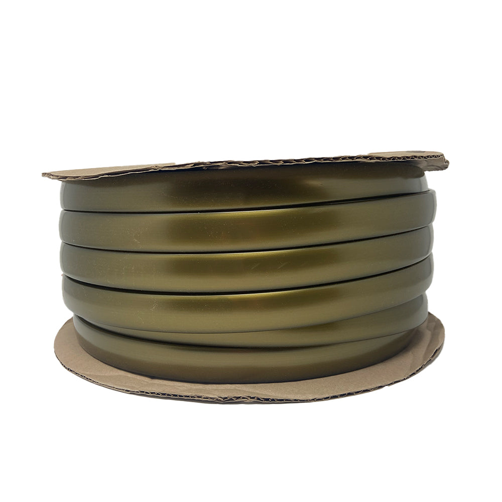 A round reel of the Airstream Premium Replacement Rub Rail for Travel Trailers, featuring sleek metallic gold flat ribbon reminiscent of the iconic Airstream style, is shown coiled and viewed from the side against a white background.