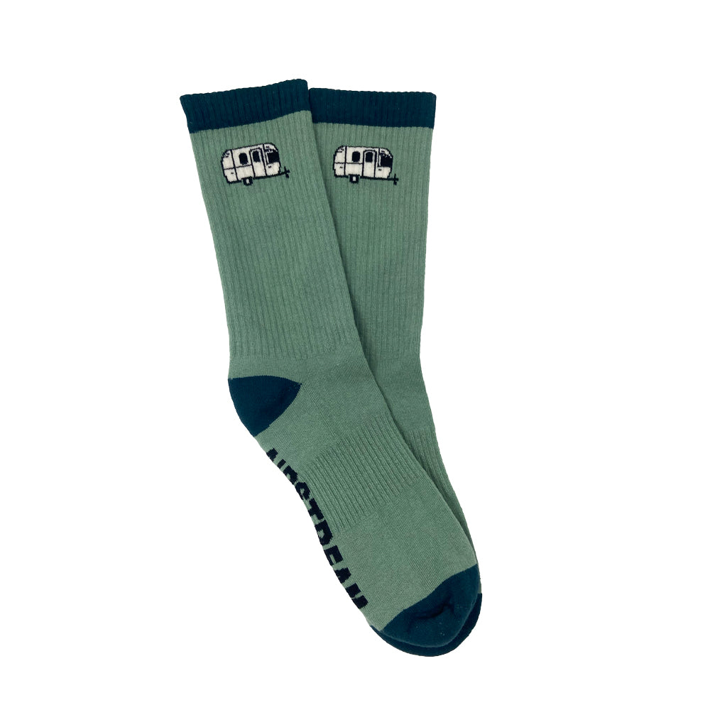 Step into adventure with the Airstream Travel Trailer Athletic Socks—green athletic socks accented by dark green toes and cuffs, and finished with a charming Airstream travel trailer graphic near the top. Perfect for adding a touch of wanderlust to your everyday look!.