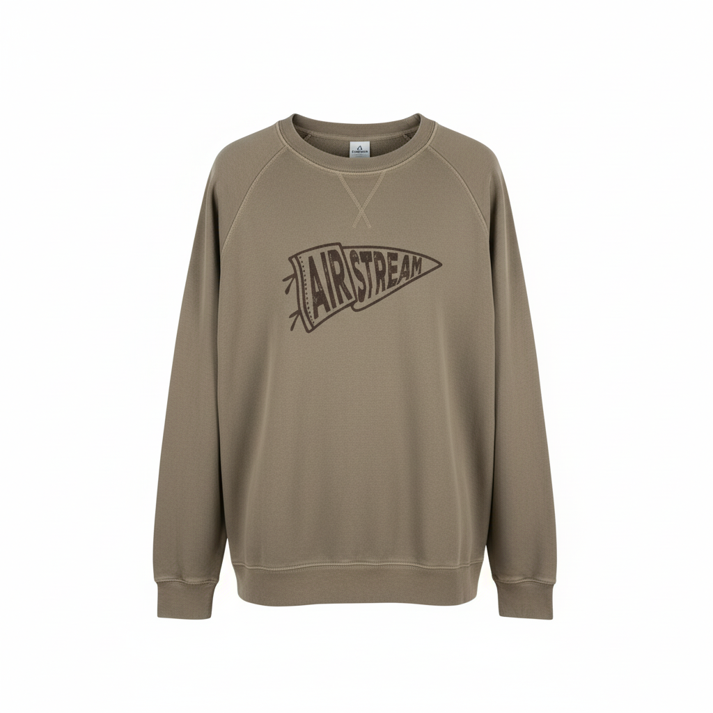 The Airstream Rally Pennant Sweatshirt, shown in khaki against a plain white background, features a bold rally pennant graphic with “AIRSTREAM” on the front—perfect for campfire gatherings.