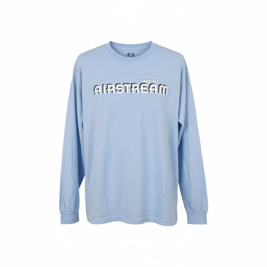 The Airstream 1931 Series Long Sleeve T-Shirt is a classic light blue shirt featuring long sleeves, with “AIRSTREAM” and “SINCE 1931” printed in bold black and white letters on the chest. This long sleeve tee is shown against a plain white background.
