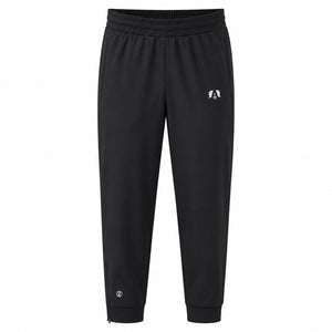 Black jogger sweatpants with an elastic waistband, ribbed ankle cuffs, and a small white circular logo on the left thigh and lower leg.
