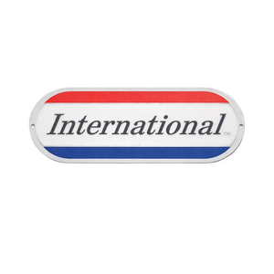 Metallic badge with 'International' text on a white background