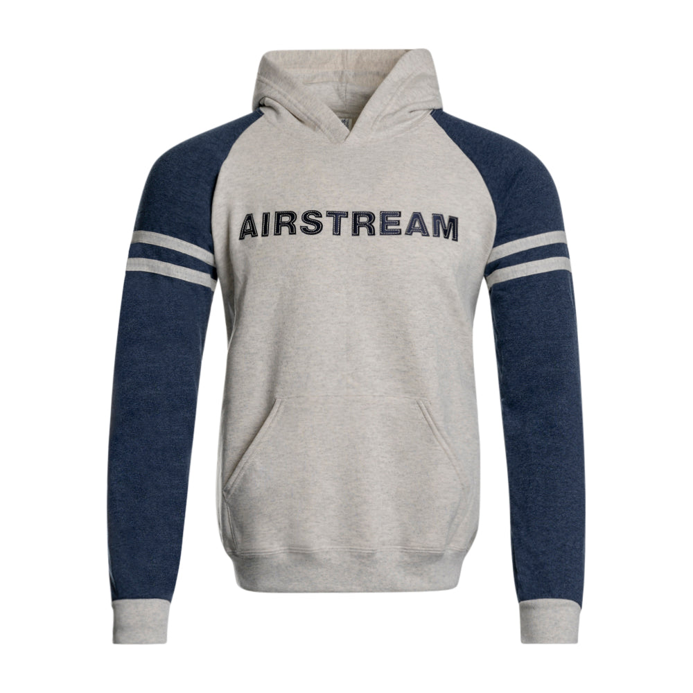 Introducing the Airstream Applique Colorblock Hoodie—a vintage-inspired design featuring soft gray fabric with bold blue sleeves and striking white and blue stripes on the arms. “AIRSTREAM” is prominently appliqued across the chest, adding a classic touch. Crafted for comfort, this colorblock hoodie includes a convenient front pocket and a hood without drawstrings.