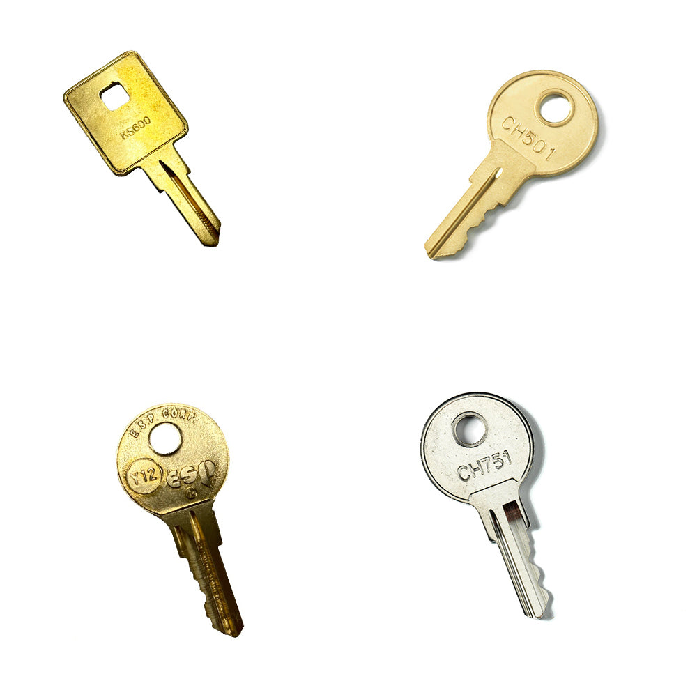 The Airstream Cut Key Bundle for Excella Travel Trailers includes four distinct pre-cut keys displayed on a white background, each featuring unique shapes and notches. Two keys have rounded heads, while the other two feature rectangular or circular designs, all engraved with various text—perfect as spare or replacement keys for your Airstream Excella trailer.