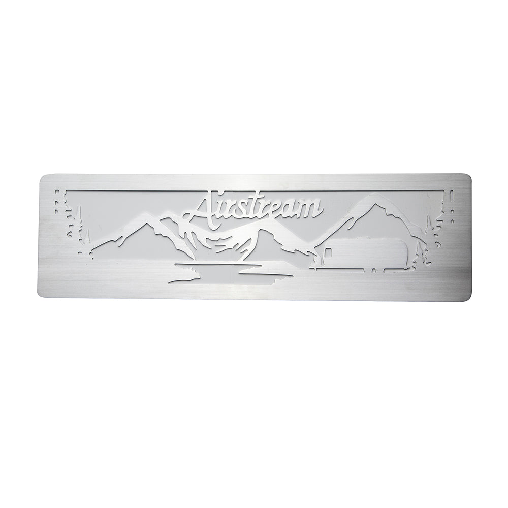 The Airstream Mountain Scene Screen Door Guard is a rectangular metal sign featuring a cutout design of mountains, trees, a small trailer, and the word “Airstream” elegantly written in cursive across the top. This custom-made piece serves as both a distinctive accent for your Airstream screen door and unique metal décor, complete with built-in metal guards for enhanced durability.