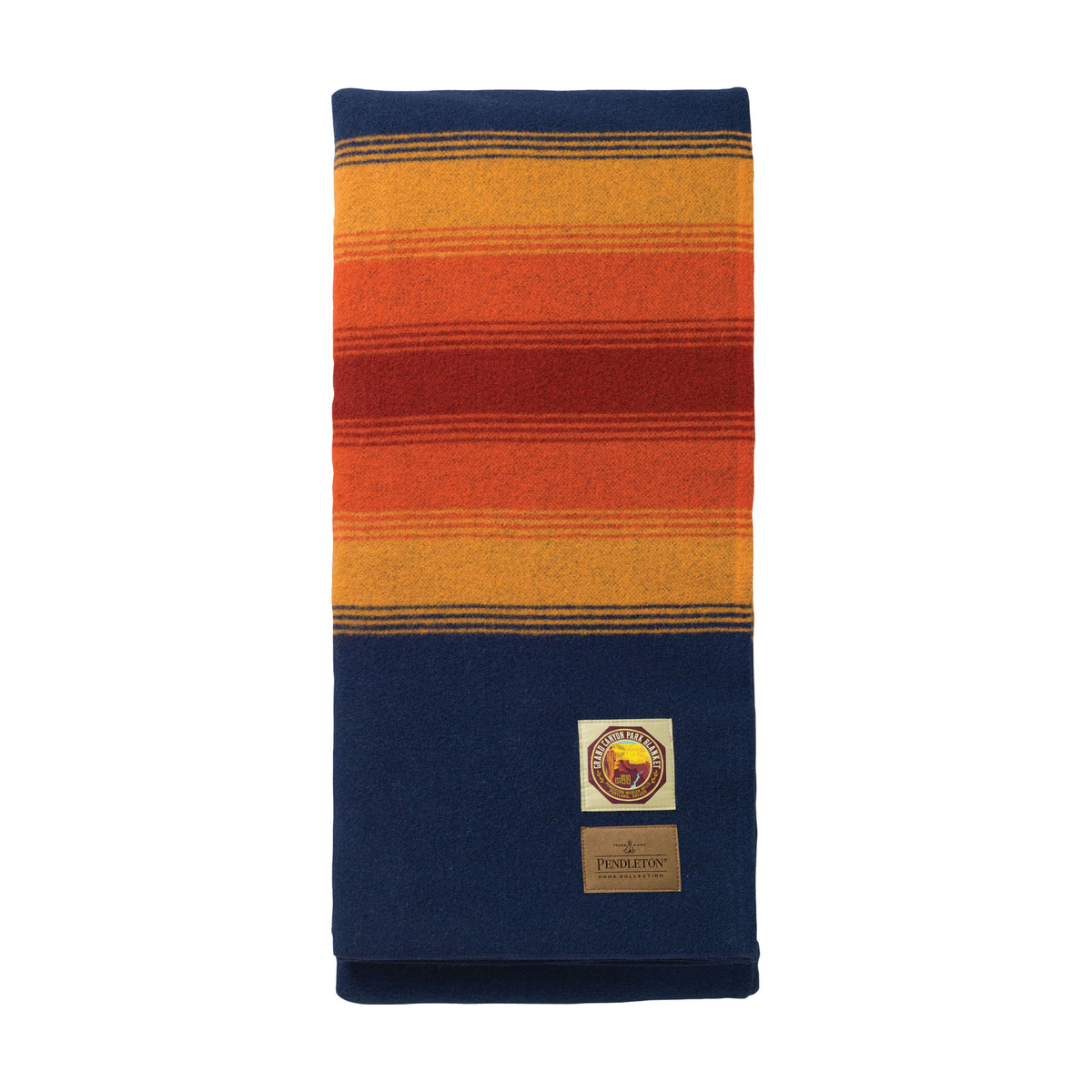A folded National Park Blanket by Pendleton, crafted from wool, displays bold horizontal orange and yellow stripes near the top with a solid dark blue section at the bottom. Made in America, this blanket features a rectangular label sewn onto the lower portion.