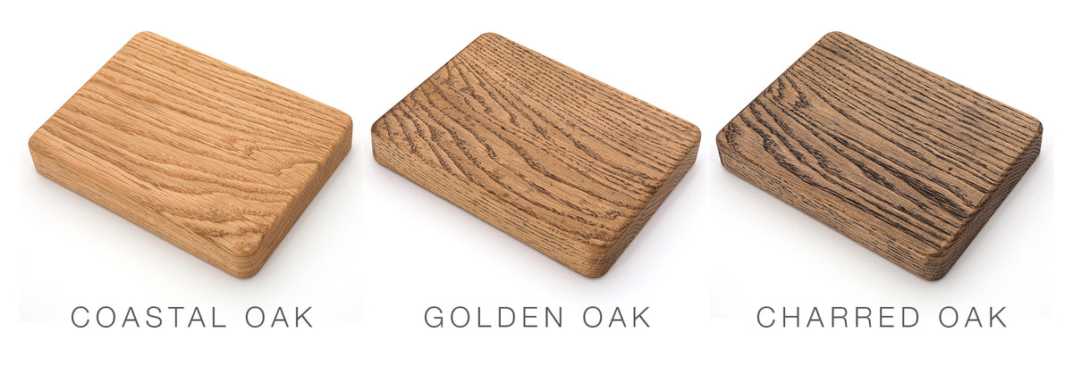 Three rectangular oak wood samples—Coastal Oak, Golden Oak, and Charred Oak—display a variety of wood grain patterns and finishes on a white background. These samples are ideal choices for the Airstream Wood Dinette Table Upgrade for Quiksilver Travel Trailers, perfect for crafting a premium tabletop or solid dinette table in your Airstream.