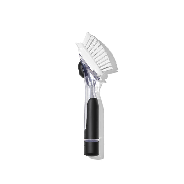 Cleaning brush with black handle on a white background