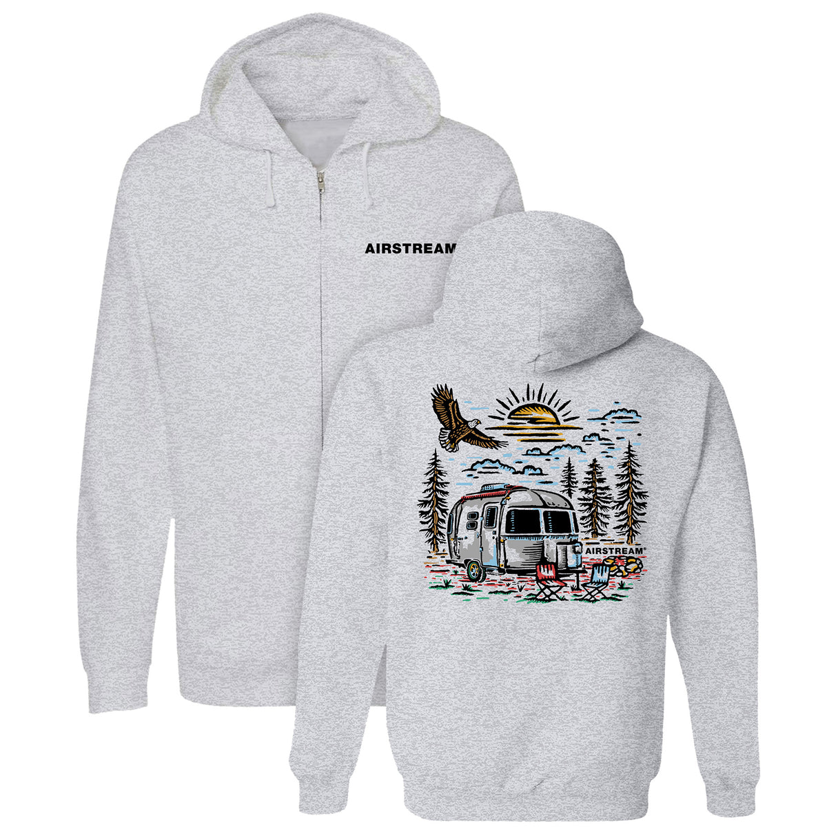 Wrap yourself in comfort with the Airstream Eagle View Zip Up Hoodie—a gray midweight zip-up featuring “AIRSTREAM” on the front left chest. The back displays a vibrant outdoor camping scene with an Airstream trailer, trees, lawn chairs, an eagle, and a setting sun—making it the perfect go-to hoodie for fall adventures.