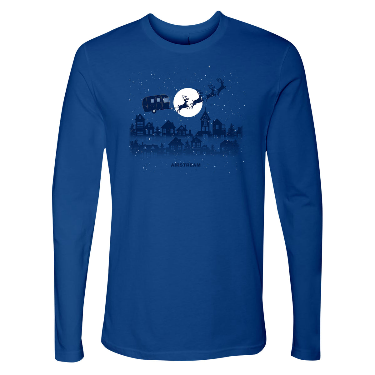 Introducing the Airstream Sleigh Holiday Long Sleeve T-Shirt—a blue tee featuring a graphic of an aluminum travel trailer pulled by reindeer soaring across a starry night sky above cozy houses, illuminated by a large moon in the background. It’s the perfect shirt for celebrating the holiday season!.
