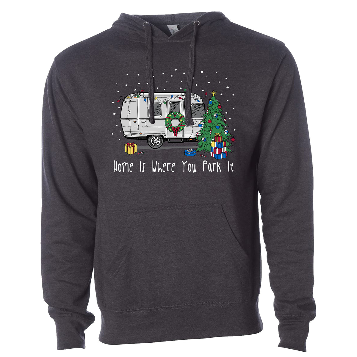 The Airstream Home is Where You Park It Holiday Hoodie features a riveted aluminum travel trailer decorated for Christmas with a wreath on the door, a tree surrounded by presents, falling snow, and the phrase “Home is Where You Park It” below—perfect for celebrating the holiday season.