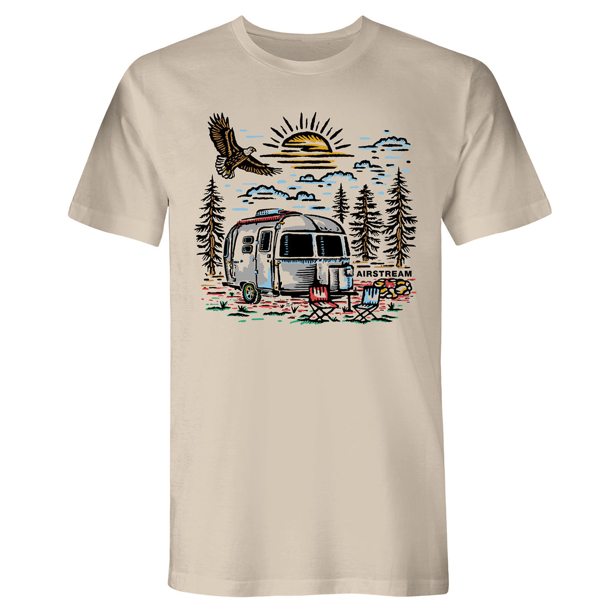 The Airstream Eagle View T-Shirt is a beige adventure tee featuring a graphic of an Airstream trailer, two chairs, pine trees, an eagle soaring overhead, and a sunrise in the background—perfect for those who love to say “Yes to Adventure.”.