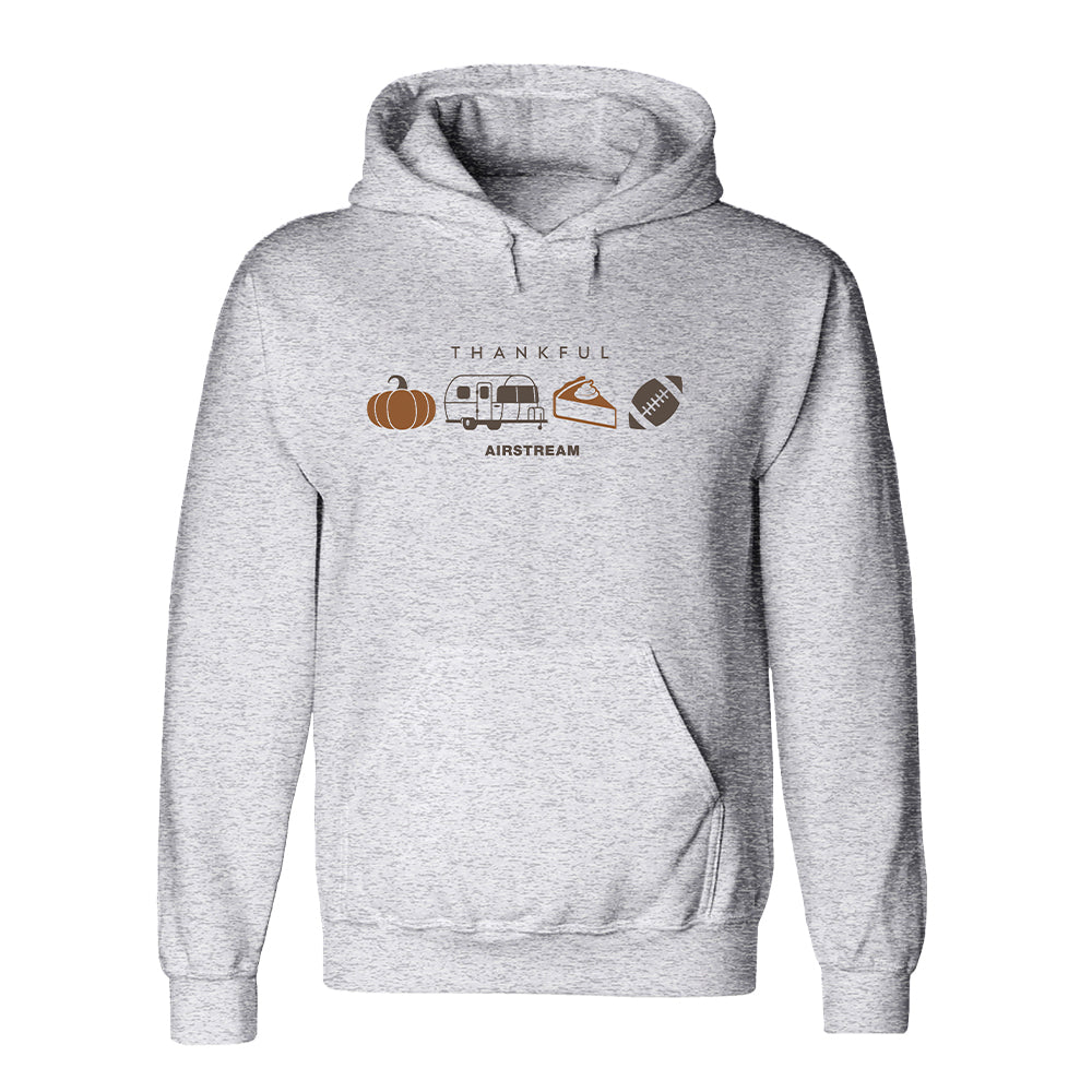 Wrap yourself in autumn comfort with the Airstream Thankful Hoodie—a soft gray hoodie adorned with warm brown and orange illustrations of pumpkins, an Airstream trailer, a slice of pie, and football icons. The cozy fall design features “THANKFUL” above the images and “AIRSTREAM” below, making it perfect for all your seasonal adventures.