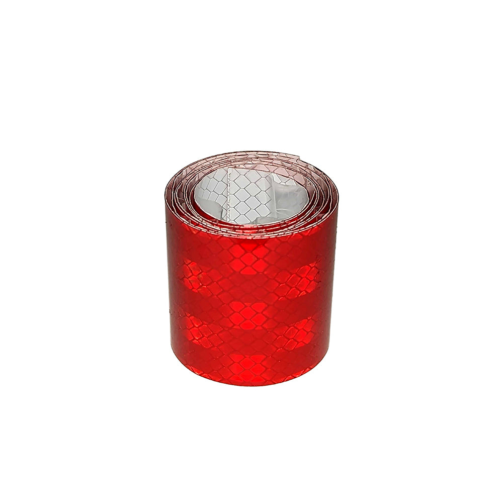 A roll of Rock Tamers Red Reflective Tape with a honeycomb pattern and weatherproof adhesive for long-lasting durability is displayed against a plain white background. Ideal for safety or decoration, these red reflective strips are perfect for use on Rock Tamers mudflap systems and other surfaces.