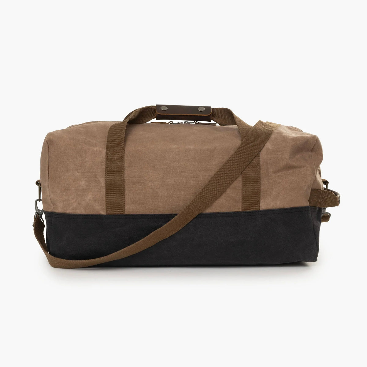 Introducing the Neelum Duffle Bag by Barebones—a stylish two-tone bag featuring a brown upper section and black lower section, complemented by brown handles and an adjustable shoulder strap. It’s perfect as your go-to weekend or travel bag for any adventure.