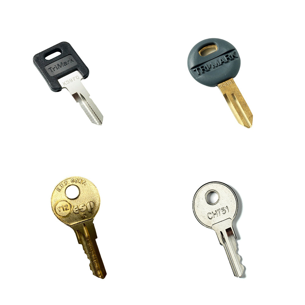Four different keys from the Airstream Cut Key Bundle for Sport Travel Trailers are arranged in a grid on a white background, each featuring unique shapes, grooves, and colored key heads—black, gray, and gold—making them perfect as spare keys.