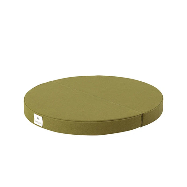 Round green cushion on a white background