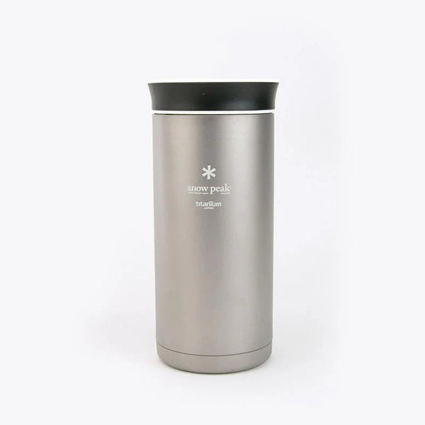 A Snow Peak travel tumbler in brushed stainless steel with a black lid, shown on a clean white background.