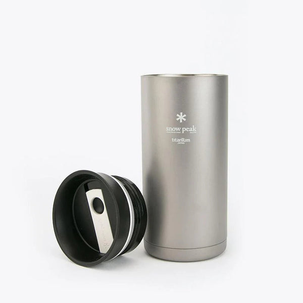 Silver insulated mug with black lid on a white background