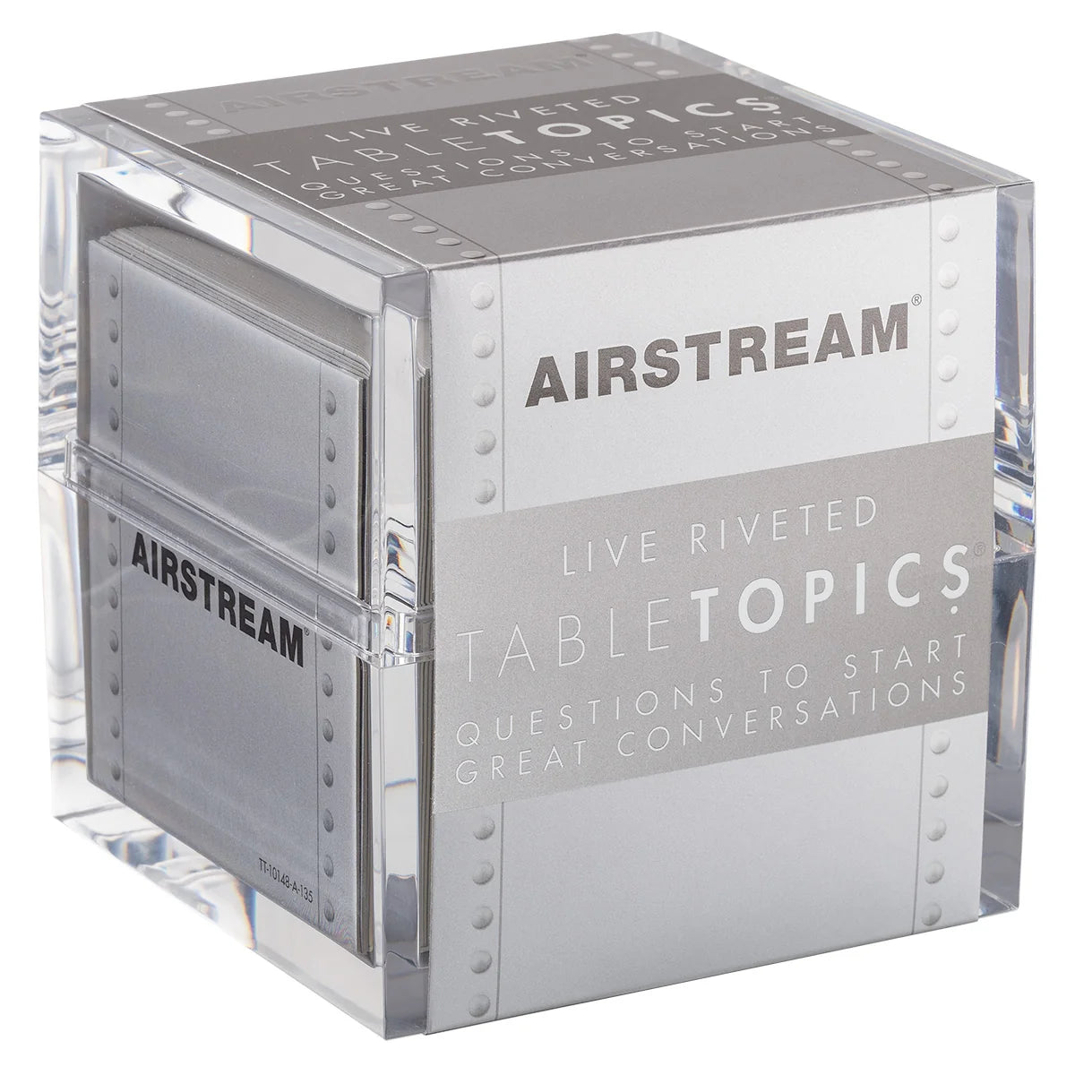 A clear, metallic, modern cube container labeled Airstream TableTopics Game filled with conversation cards. The box reads “Questions to start great conversations” and is perfect for sparking memorable moments—whether you’re on the road with your Airstream trailer or at home.