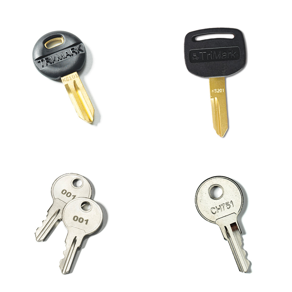 The Airstream Cut Key Bundle for Pottery Barn Travel Trailers includes four pre-cut keys: two with black plastic TriMark heads and two with silver metal heads, featuring pairs labeled 001 and CH751. These keys are ideal as travel trailer spares or replacements for your Airstream Pottery Barn key.