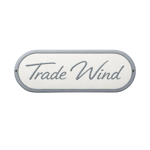 Decorative sign with 'Trade Wind' text on a white background