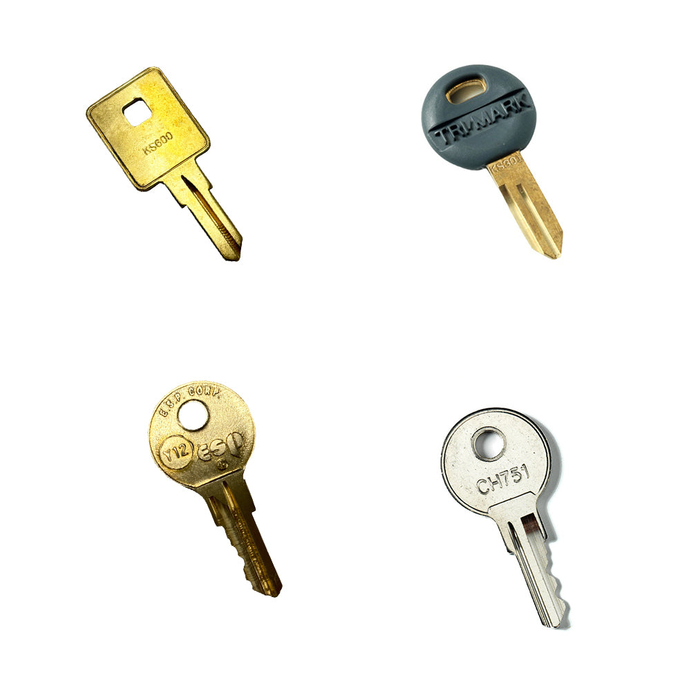Four uniquely shaped pre-cut keys from the Airstream Cut Key Bundle for Flying Cloud Travel Trailers are displayed on a white background, featuring both round and square head designs—perfect as spare or replacement keys for your Airstream Flying Cloud.