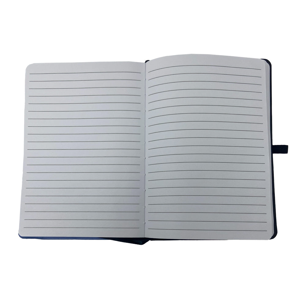 An open Airstream Wally Byam Mural Distressed Journal with lined pages lies flat on a white background. The blank pages, free of writing or markings, are perfect for capturing new adventures and memories.