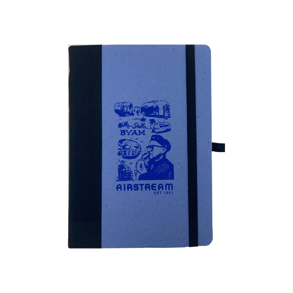 Airstream Wally Byam Mural Distressed Journal featuring a blue cover with black spine and elastic closure, adorned with blue illustrations of a man, trailers, and the text “Mr. & Mrs. BYAM” along with “AIRSTREAM EST 1931”—evoking the nostalgic charm of a vintage pulp cover. Perfect as a travel journal for your next adventure or as an Airstream Wally Byam Mural Journal.