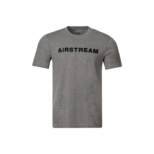 The Airstream 1931 Wanderlust T-Shirt features a gray short-sleeve design with “AIRSTREAM” boldly printed in black capital letters across the chest. Crafted from soft USA-grown cotton, this shirt is showcased on a plain white background, making it a timeless piece for the wanderlust collection.