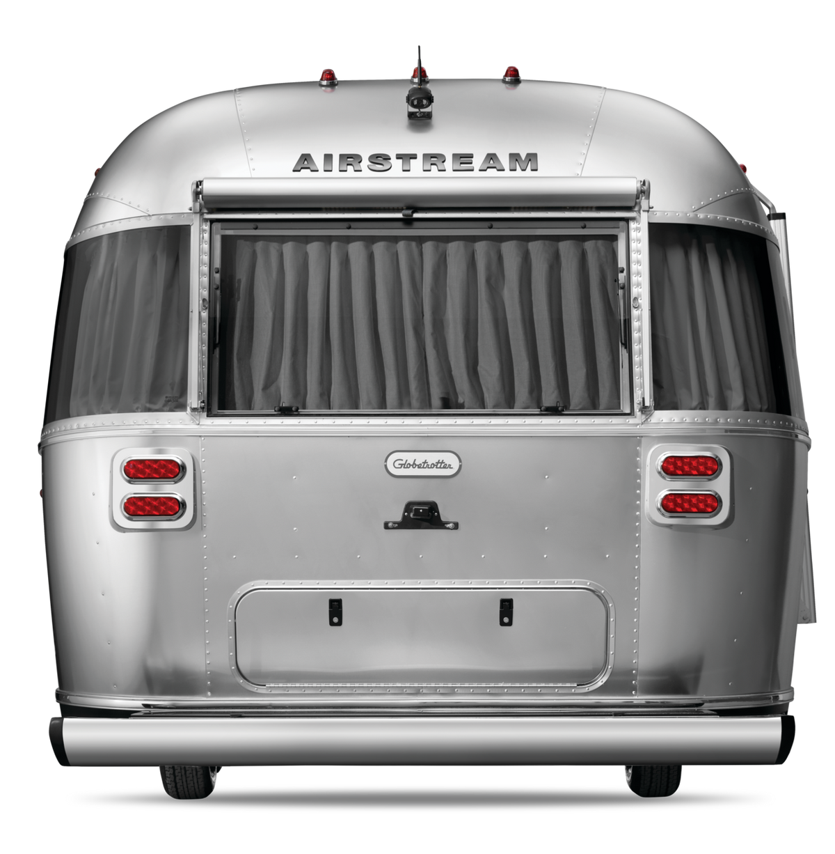 Silver Airstream trailer with curtains on a white background