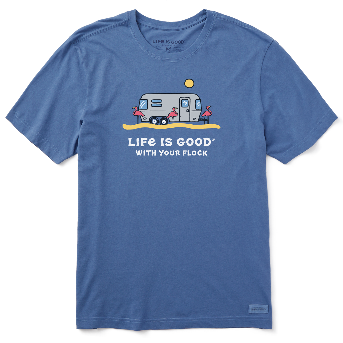 The Airstream With My Flock T-Shirt by Life is Good® features a blue design with a cartoon trailer, a shining sun, and four pink flamingos. Perfect for Airstream enthusiasts or anyone who loves whimsical campground apparel, it displays the phrase “LIFE IS GOOD WITH YOUR FLOCK” below the artwork.