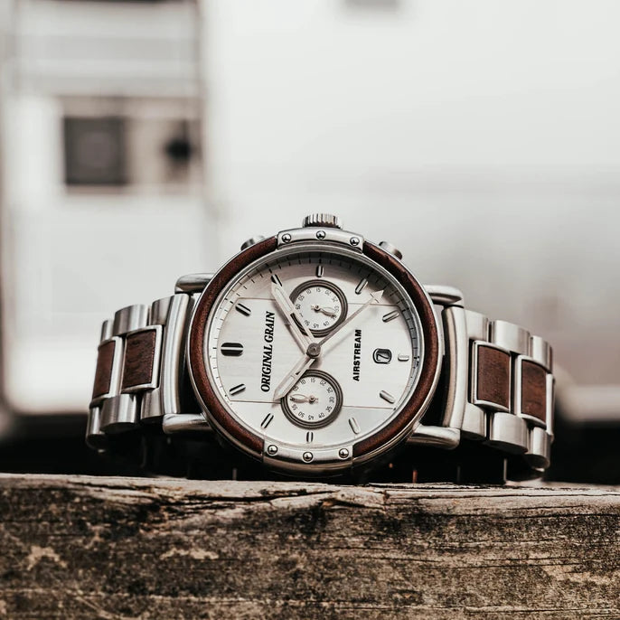 Luxury watch with wooden accents on a wooden surface