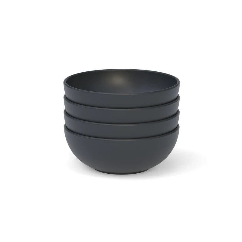 The Bamboo Round Cereal Bowl Set of 4 by Ekobo, crafted from bamboo eco-composite in a matte black finish, is neatly stacked on a white background.