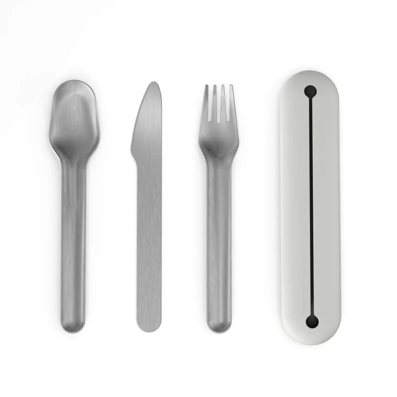 The “Stainless Steel Cutlery Trio with Case Set of 2” by Ekobo features a stainless steel spoon, knife, and fork neatly arranged beside a sleek white case on a white background, creating an elegant and travel-ready portable cutlery set.