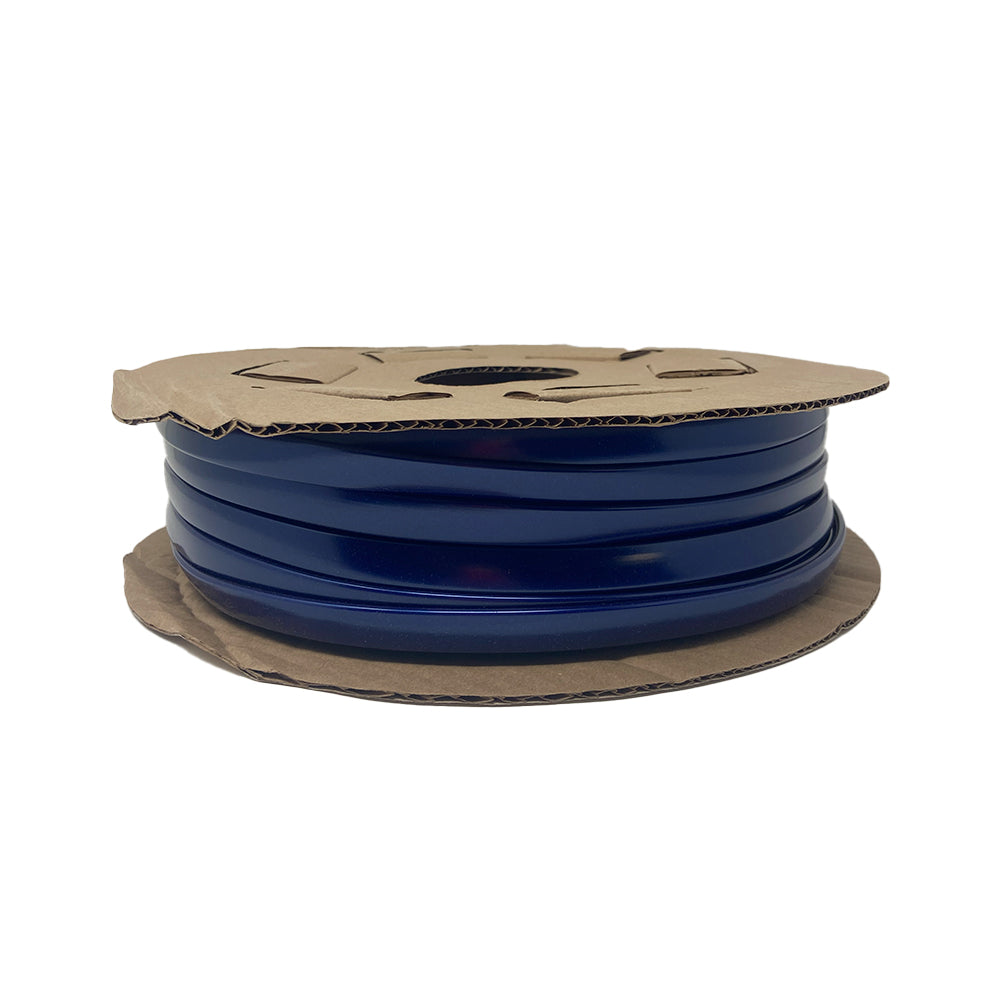 A spool of Airstream Premium Replacement Belt Trim for Travel Trailers in dark blue, wound on a cardboard reel, commonly used for 3D printing Airstream exterior accessories or crafting custom aluminum Airstream trim.