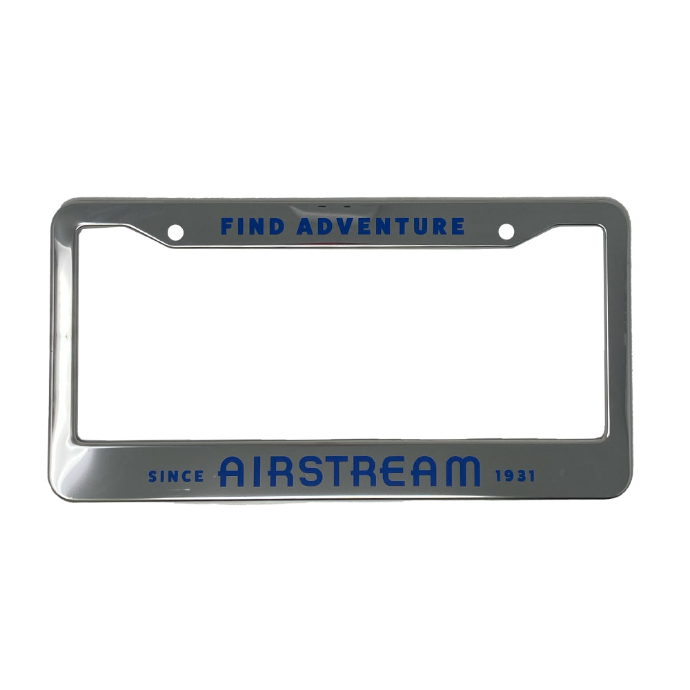The Airstream Find Adventure License Plate Frame features a sleek silver design with bold blue text—“FIND ADVENTURE” at the top and “SINCE AIRSTREAM 1931” at the bottom. Designed for road trip enthusiasts, this stylish frame leaves the center area open to showcase your license plate.