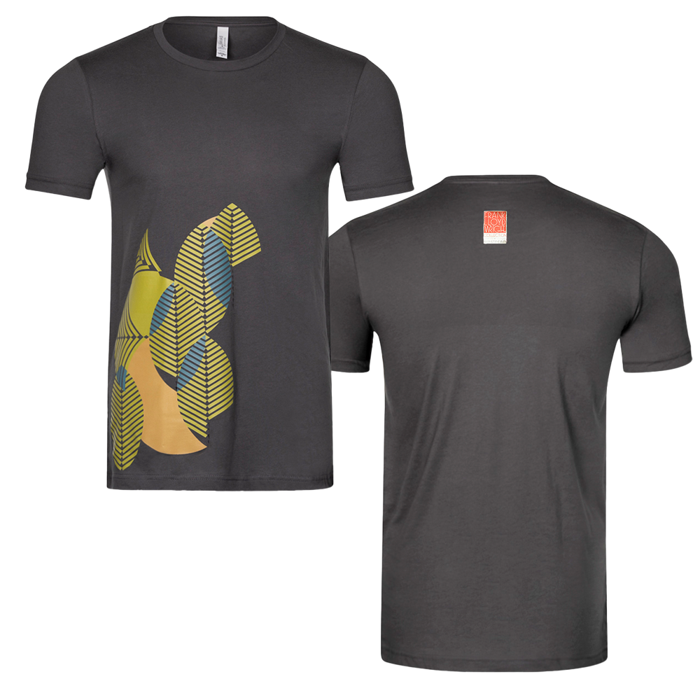 Front and back view of the Frank Lloyd Wright X Airstream Classic Fit T-Shirt in dark gray, featuring an abstract yellow and blue leaf design on the front and a small orange rectangular label near the upper back neckline. This limited-edition piece showcases a unique architectural design inspired by iconic Frank Lloyd Wright aesthetics.