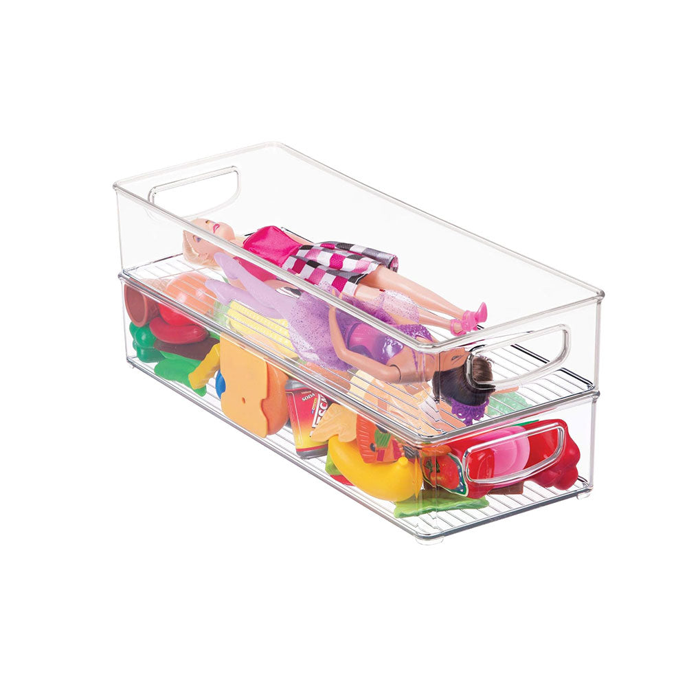 A Stackable Storage Bin, 16 x 6 x 3, with handles holds a doll resting on top and various colorful toy food items neatly arranged underneath.